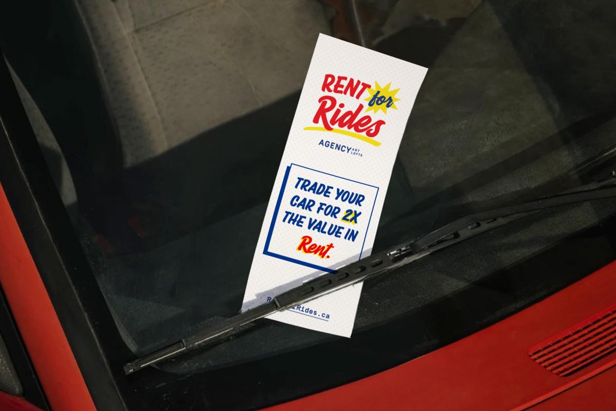 A Rent for Rides card tucked beneath a car’s windshield wiper reads, ‘Trade your car for 2X the value in rent.’