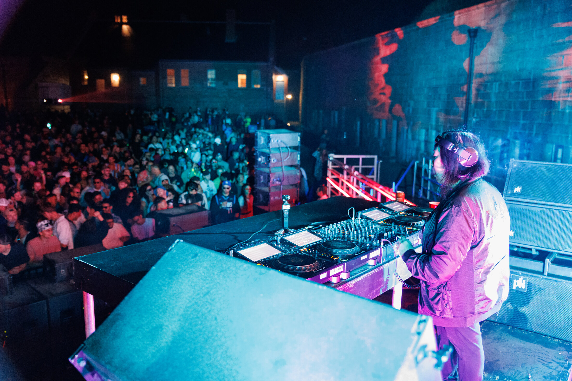 A DJ performs for a crowd inside the illuminated Halifax Citadel during Vibrancy Festival