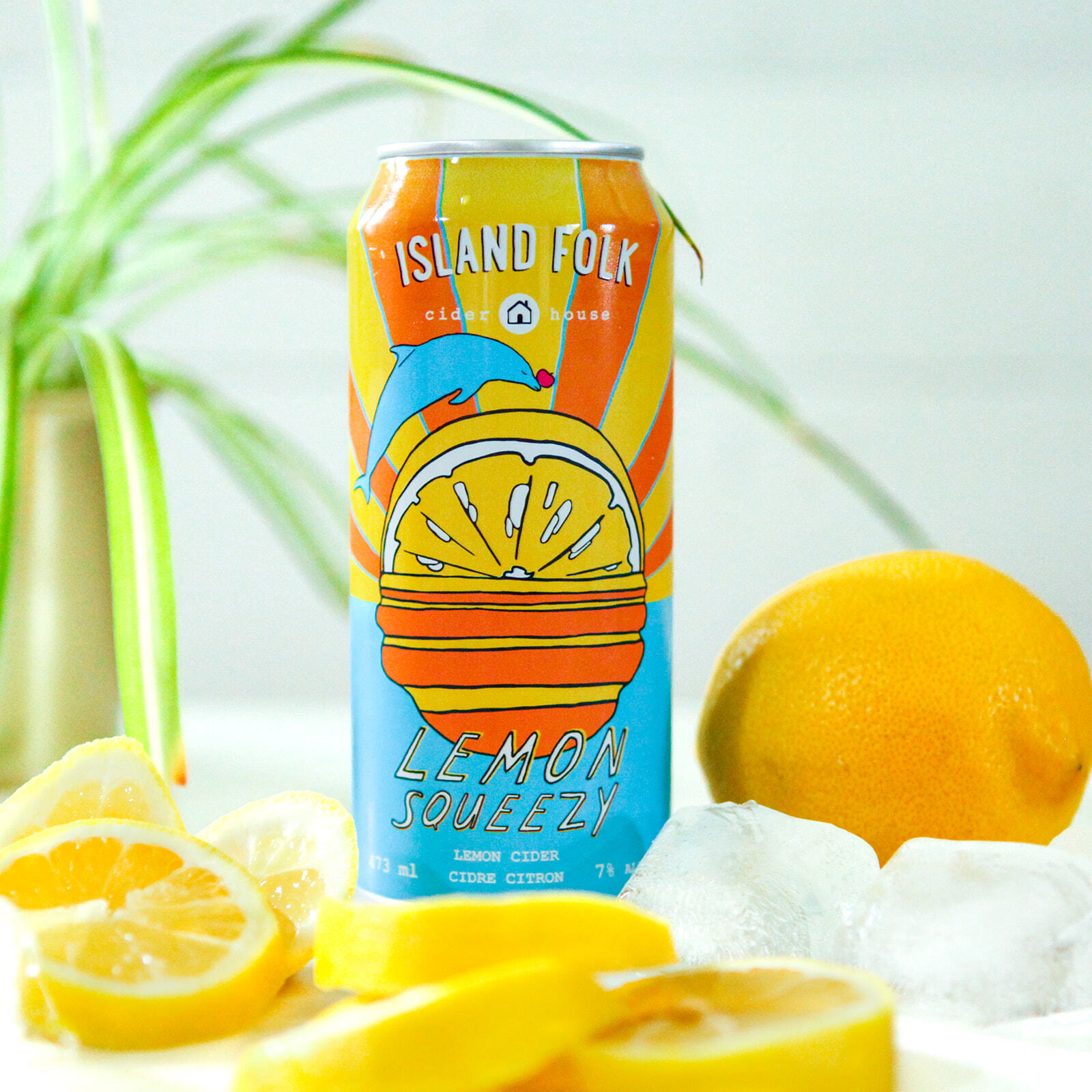 A can of Island Folk Lemon Squeezy cider surrounded by lemons and ice